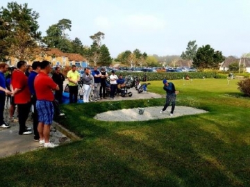 One of the teaching professionals demonstrating bunker play